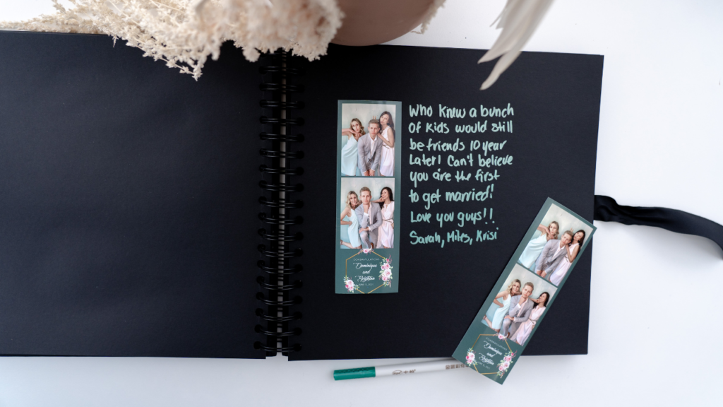 Photo Booth custom book on display at a rustic barn venue in Wisconsin